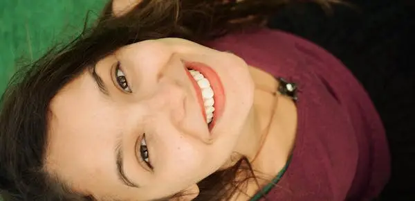 woman smiling - Common Characteristics of Self-Confident Individuals